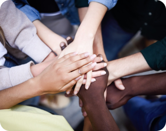 people stacking their hands